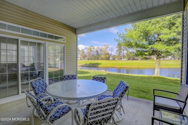 view of patio featuring a water view