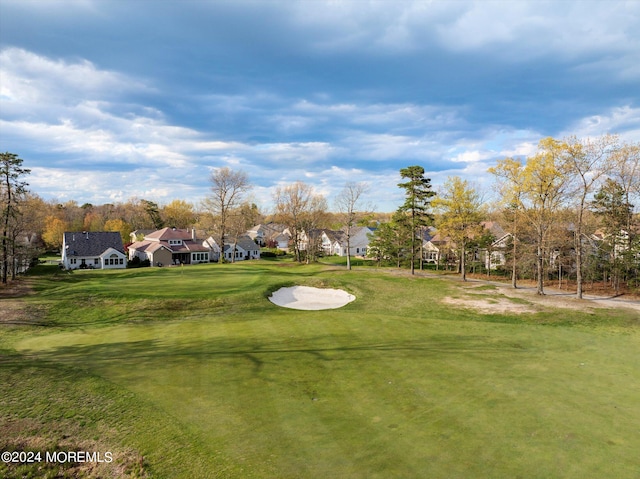 view of home's community featuring a lawn