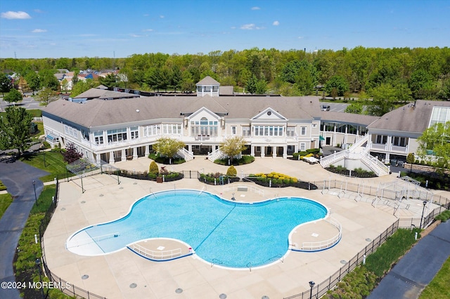 view of swimming pool featuring a patio