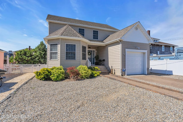 front of property with a garage