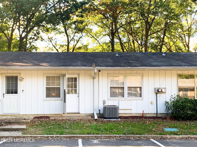 ranch-style home featuring central air condition unit