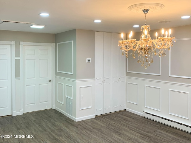 interior space featuring an inviting chandelier, dark hardwood / wood-style floors, and a baseboard radiator