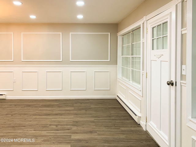 interior space featuring dark hardwood / wood-style flooring and a baseboard radiator