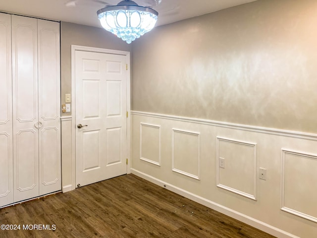 interior space featuring dark hardwood / wood-style floors and a chandelier