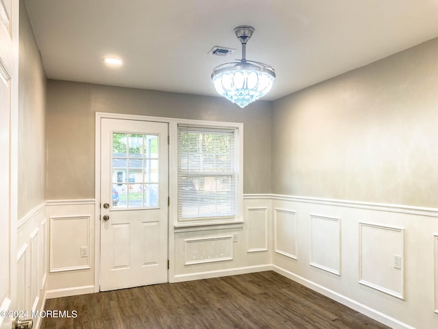 doorway to outside with dark hardwood / wood-style floors