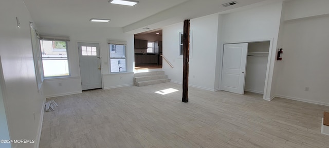 foyer entrance with light wood-type flooring