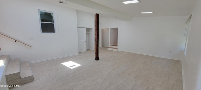 basement featuring light hardwood / wood-style floors