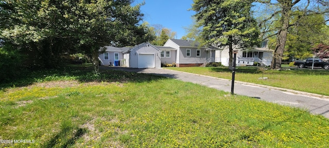 single story home with a front lawn and a garage