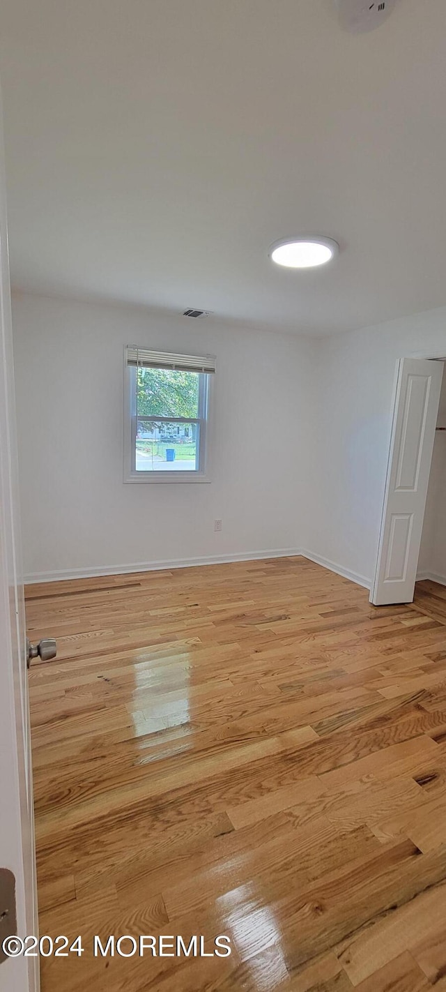 unfurnished room featuring light wood-type flooring