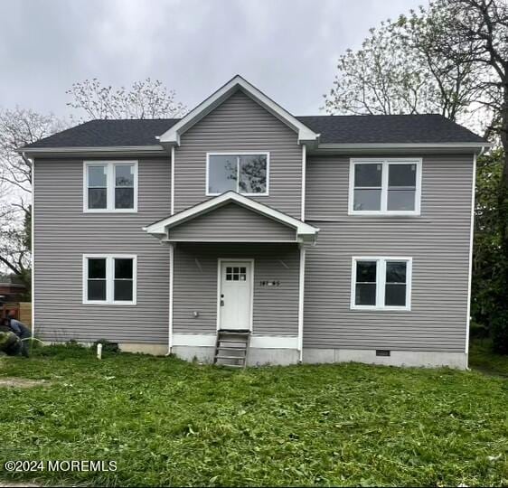 view of front of home with a front lawn