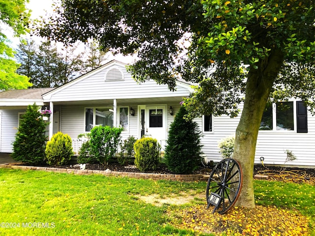 bungalow-style home with a front lawn