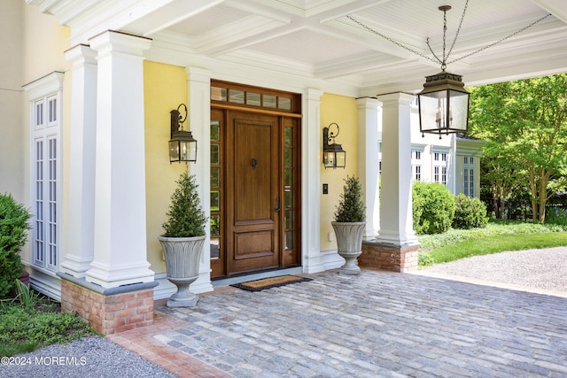 entrance to property featuring covered porch