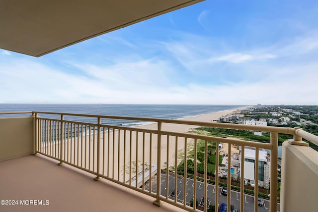 balcony with a view of the beach and a water view