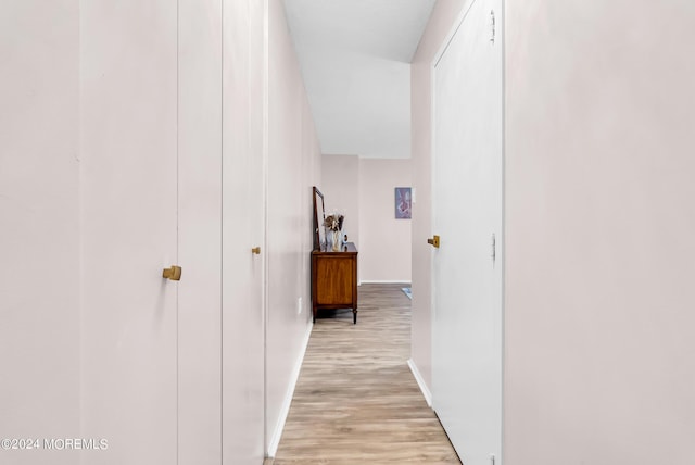 corridor featuring light hardwood / wood-style flooring