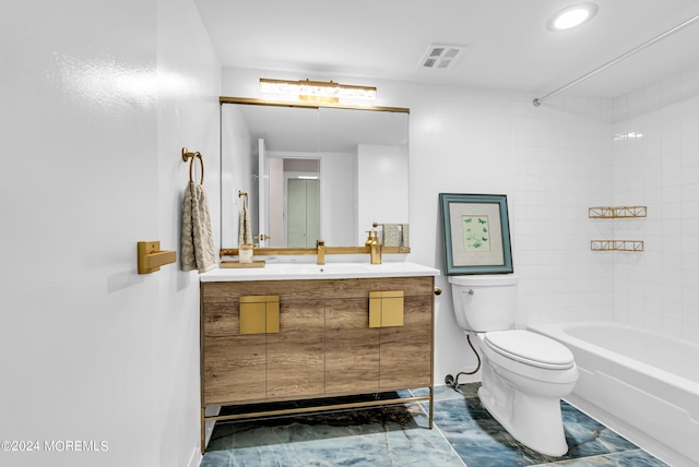 full bathroom with vanity, tiled shower / bath, and toilet