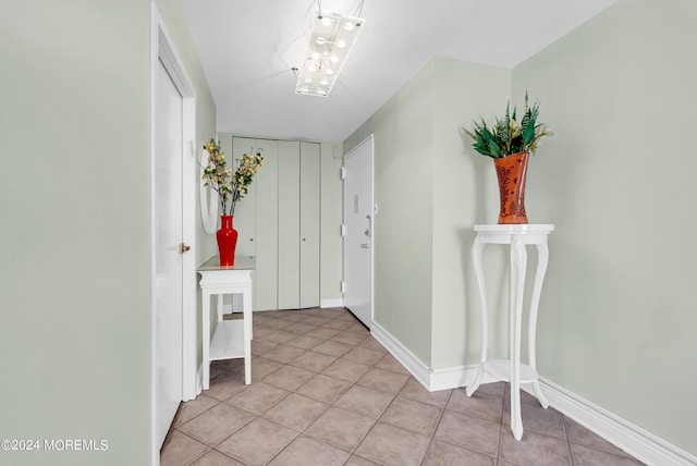 foyer entrance with light tile patterned flooring