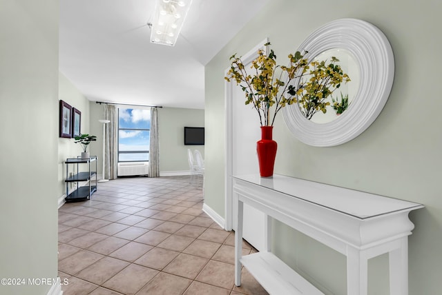 hall featuring light tile patterned flooring