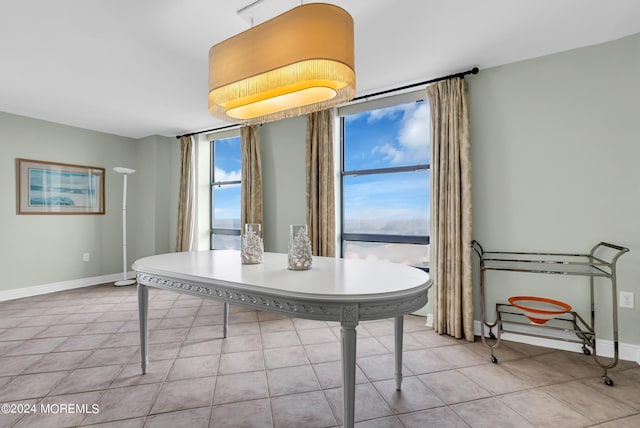 dining area featuring light tile patterned floors