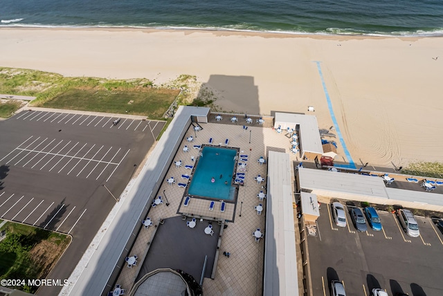 aerial view featuring a water view and a beach view