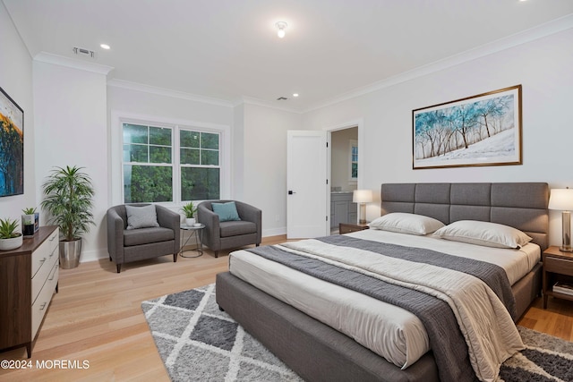 bedroom with crown molding and light hardwood / wood-style flooring