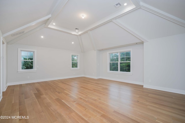 interior space with light hardwood / wood-style flooring, lofted ceiling with beams, and a wealth of natural light