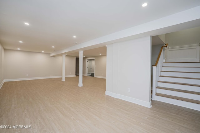 basement featuring light hardwood / wood-style floors