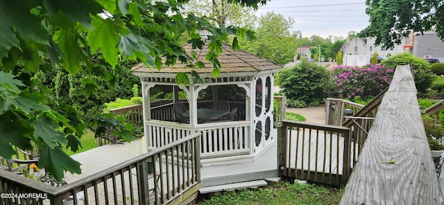 wooden terrace with a gazebo