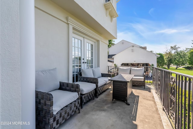 view of patio / terrace with a balcony and an outdoor hangout area