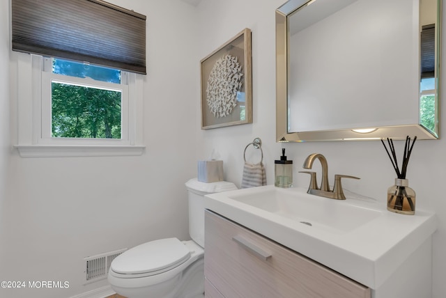 bathroom with vanity and toilet