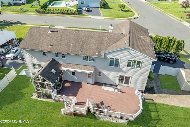 back of property featuring a deck