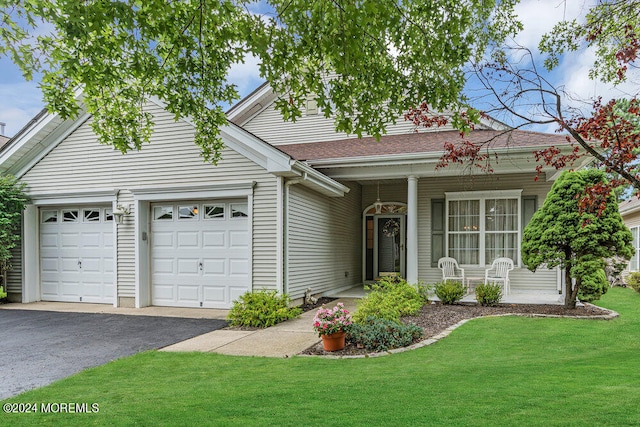 view of front facade with a garage and a front lawn