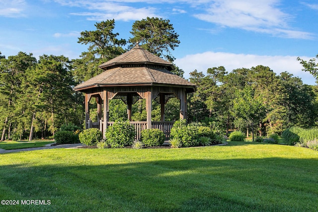 view of community with a lawn and a gazebo