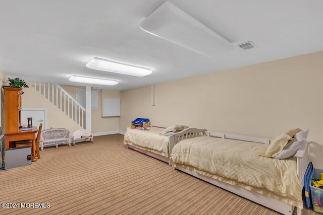 bedroom featuring light colored carpet