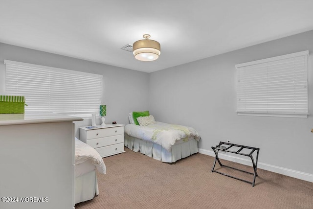 bedroom with light colored carpet