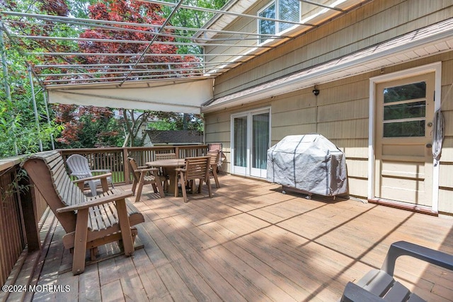 wooden deck featuring grilling area