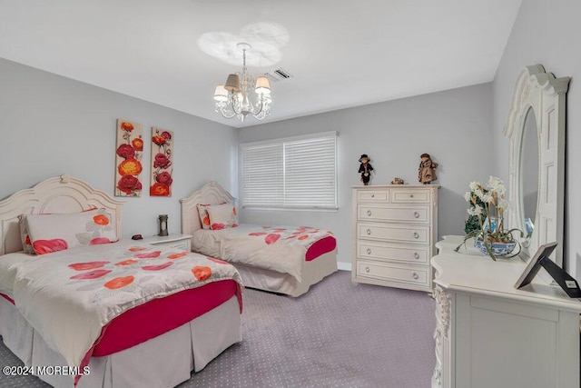 bedroom with light carpet and an inviting chandelier