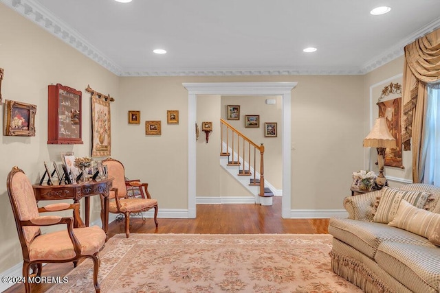 sitting room featuring light hardwood / wood-style floors and ornamental molding