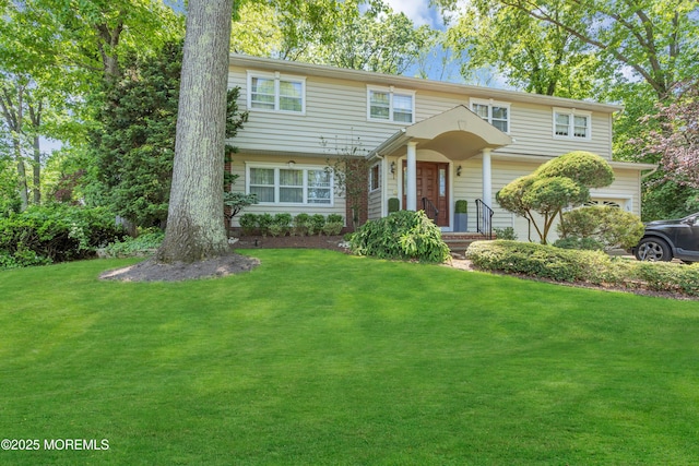 65 Chicanos Dr, Lakewood, NJ 08701 - view of front facade with a front yard and a garage