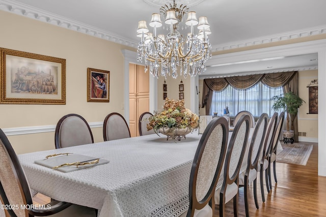 65 Chicanos Dr, Lakewood, NJ 08701 - dining room with wood finished floors and a chandelier