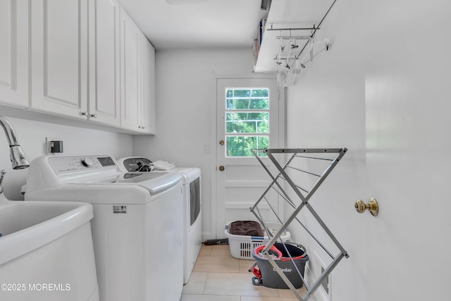 65 Chicanos Dr, Lakewood, NJ 08701 - laundry room featuring cabinet space, washing machine and clothes dryer, and light tile patterned floors