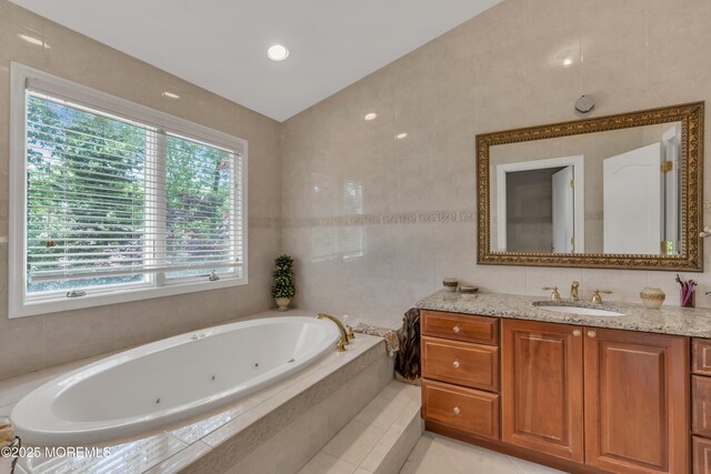 65 Chicanos Dr, Lakewood, NJ 08701 - full bath with vanity, a tub with jets, tile patterned flooring, and tile walls