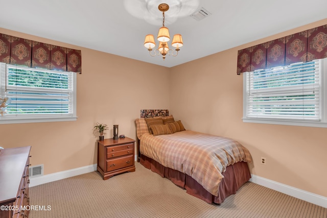 65 Chicanos Dr, Lakewood, NJ 08701 - bedroom featuring a chandelier and light colored carpet