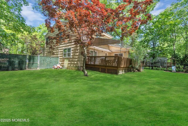 65 Chicanos Dr, Lakewood, NJ 08701 - fenced backyard with a deck