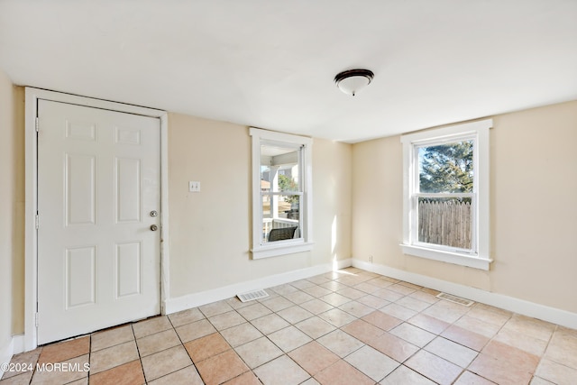 107 18th Ave, Belmar, NJ 07719 - entrance foyer with light tile patterned floors and baseboards