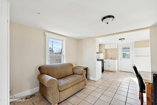 107 18th Ave, Belmar, NJ 07719 - living area with light tile patterned floors, baseboards, and plenty of natural light