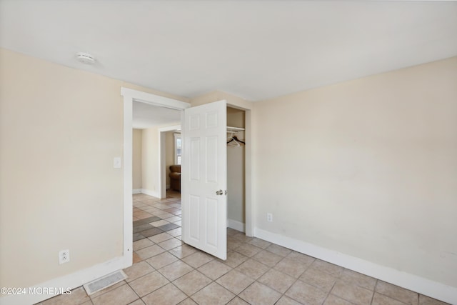 107 18th Ave, Belmar, NJ 07719 - unfurnished bedroom with baseboards and light tile patterned floors