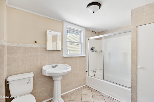 107 18th Ave, Belmar, NJ 07719 - bathroom featuring toilet, shower / bath combination with glass door, tile walls, and tile patterned floors