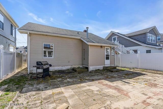 rear view of house with a patio area