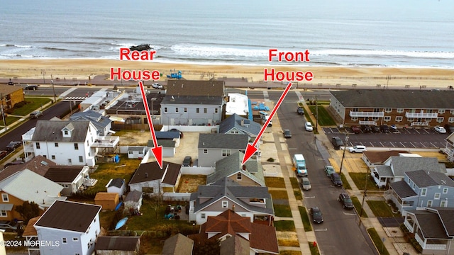 aerial view featuring a beach view and a water view