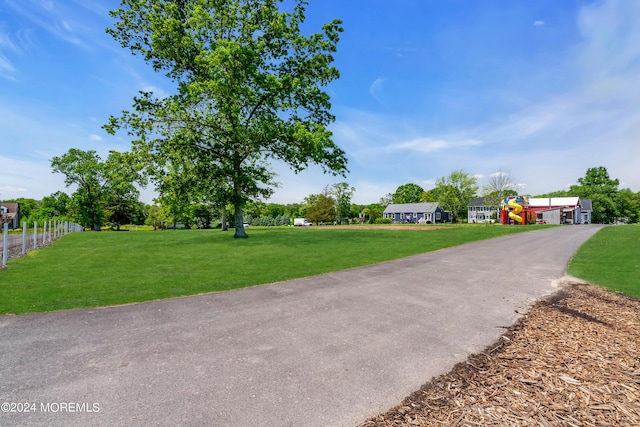 exterior space featuring a yard and a playground